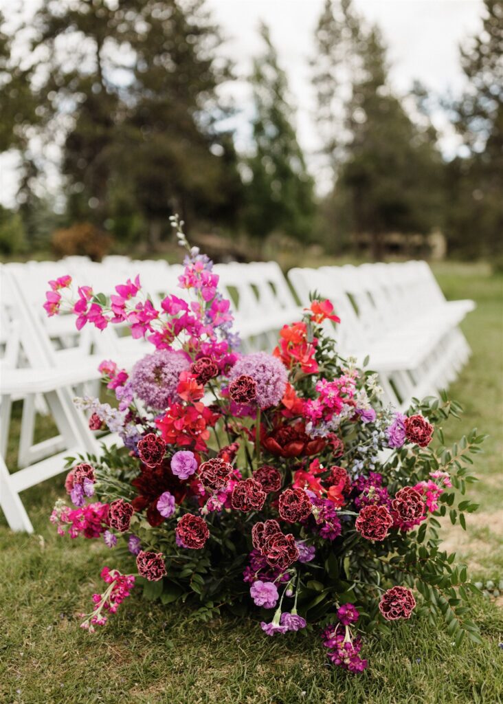 Large colorful ceremony aisle flowers